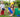 A boy and a girl happily enjoying playing outdoors with colorful jumbo building blocks from Biggo Blocks