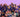 Group photo of Multivium Here 4 Fun Day attendees, with children in front holding a colorful “All Good Friends” sign built from Biggo Blocks.
