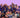 Group photo of Multivium Here 4 Fun Day attendees, with children in front holding a colorful “All Good Friends” sign built from Biggo Blocks.
