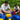 Father and son playing together on the grass with colorful jumbo building blocks, enjoying outdoor bonding time on a sunny day.