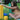 A girl building with colorful blocks on the grass, focused on stacking a yellow block. 