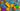 Bright and colorful building blocks scattered on a grey carpet, showcasing their vibrant colors and simple design.