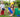 A boy and a girl happily enjoying playing outdoors with colorful jumbo building blocks from Biggo Blocks