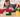 A young girl intensely focused on building a structure with colorful Biggo Blocks, demonstrating the benefits of educational play.